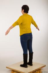 Whole body yellow sweater blue jeans black shoes a pose of Gwendolyn